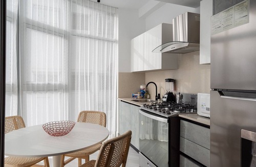 Ensanche Quisqueya Apartment | 1BR Piantini King Suite Near Blue Mall, Pool & Sauna | YellowKey