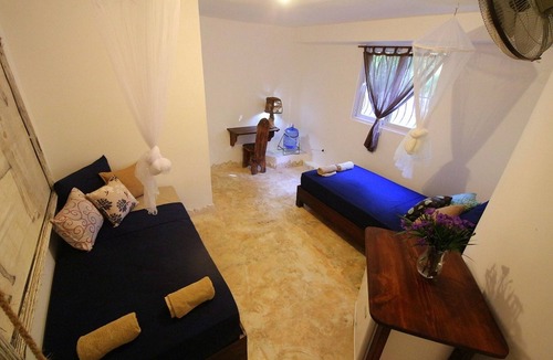 Cabarete House | Budget room in beachfront guesthouse, steps from Playa Encuentro's surfing spot