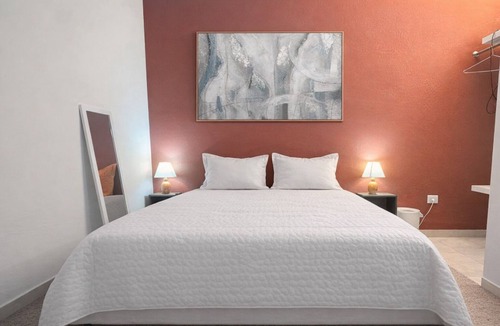 El Batey Apartment | Central & Secure: Pool Fast WiFi Private Hotel amenities.