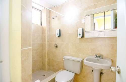 El Batey Hotel | Dowtown guest-friendly hotel room steps from all shops/bars/beaches