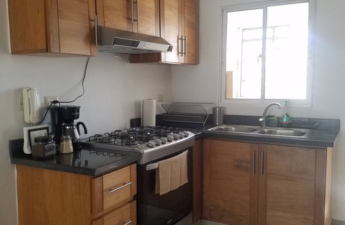San Pedro de Macoris Condo | Lovely 2-bedroom apartment with private parking