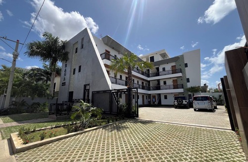 Higuey Apartment | Luxury Minimalist Suite with a Private Living Room and Kitchenette, near the squares.