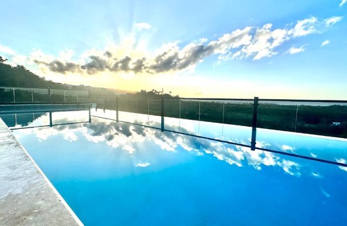 La Ceiba Apartment | Stylish Condo with TreeTops and Ocean Views