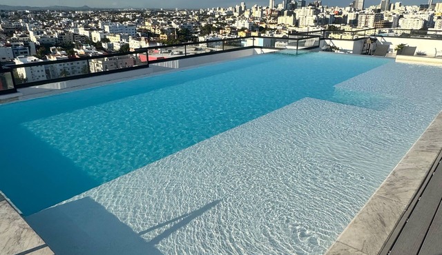 Luxury 2BR Skyline Retreat + Pool, Balcony & Parking - Bella Vista Santo Domingo in Santo Domingo