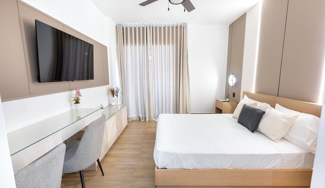 Luxury Suite Downtown Punta Cana. 2 min Walk to Coco Bongo Pool, Gym & Parking in Punta Cana