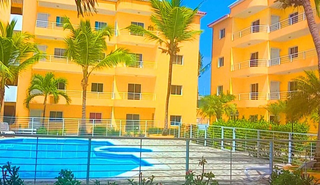Villa Sol Apartments in Punta cana with Panoramic View Pool lights at Night in Bavaro