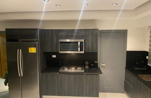 Ensanche Quisqueya Apartment | Luxurious Downtown Apt, Rooftop Pool, Gym