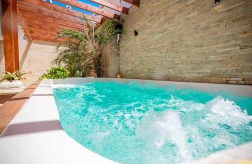 El Batey House | Getaway room with shared Jacuzzi in the center